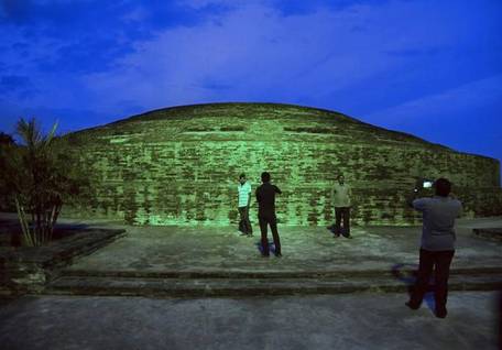 Visitors taking photos of the Buddhist Stupa after the launch of illumination project at Nelakondapalli in Khammam district on Tuesday.