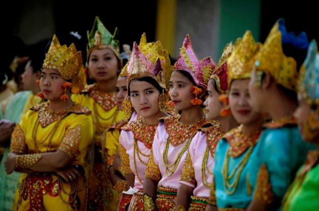 Description: Myanmar girls in ceremonial dresses wait to take part in the 2600th anniversary celebrations of Shwedagon Pagoda in Yangon,
 Myanmar, Wednesday, Feb. 22, 2012. Photo: Altaf Qadri / AP