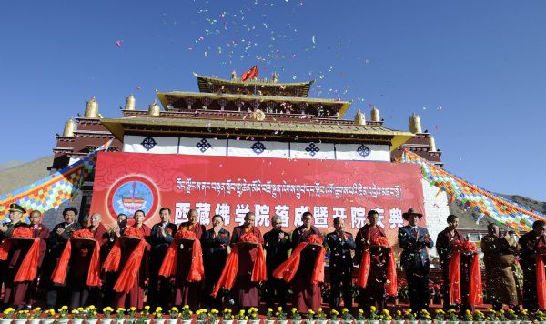 Description: Delegates attend the opening ceremony of the newly-built Tibet Buddhism University, Tibet's only regional-level buddhist theological academy, in Nyetang Township of Quxu County in Lhasa, capital of southwest China's Tibet Autonomous Region , Oct. 20, 2011.  The university, which aims to promote the study of Tibetan Buddhism, opened on Thursday. Featuring a distinctive Tibetan architecture style, the university covers an area of 268 mu (about 17.9 hectares), with a total investment of more than 103 million yuan (about 16.1 million U.S. dollars). Construction of the university started in October 2008 and ended in September this year.  (Xinhua/Chogo) (ry)  
