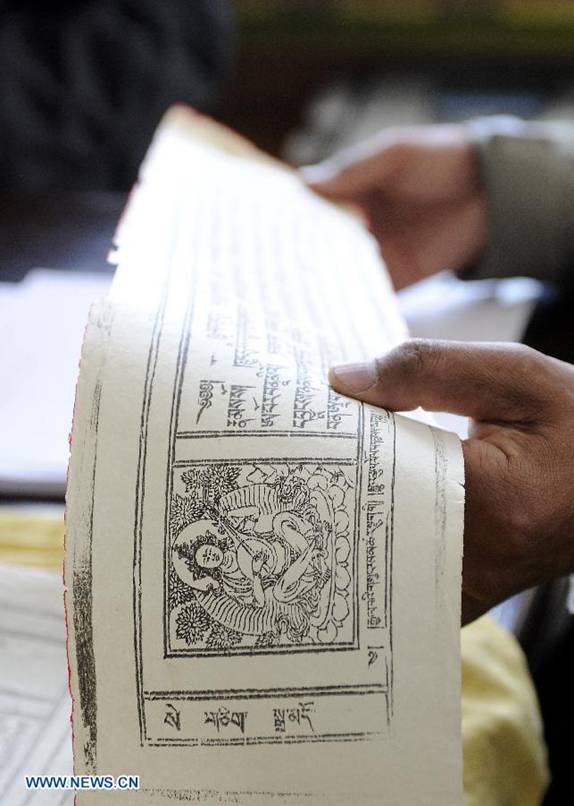 Photo taken on Nov. 21, 2012 shows the photocopy of Palm-Leaf Manuscripts of Buddhist Sutras in Lhasa, capital of southwest China's Tibet Autonomous Region. The palm-leaf manuscripts of Buddhist sutras have been well preserved in China. Palm-Leaf sutras refer to the Buddhist classics inscribed on the leaves of palm trees
