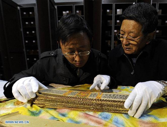 Photo taken on Nov. 21, 2012 shows the Palm-Leaf Manuscripts of Buddhist Sutras preserved at the museum in Lhasa, capital of southwest China's Tibet Autonomous Region.
