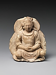 Description: Seated Bodhisattva with Combined Halo and Mandorla