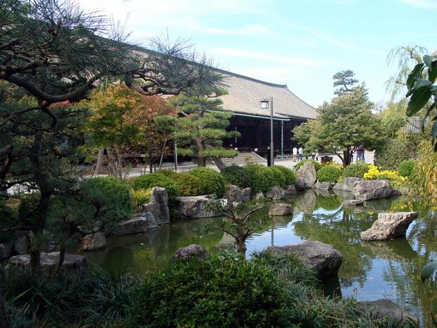 Japanese-style garden at Sanjusangen-do Buddhist Temple  Kyoto  Japan. The Main Hall can be seen in ...