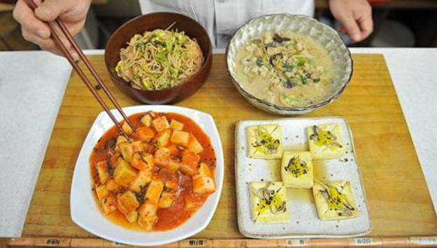(Anti-clockwise from&nbsp;bottom right) Tofu sauteed in plum sauce, mushroom casserole, noodles mixed in chilli sauce and vegetables and radish kimchi, presented after a cooking class at&nbsp;South Korean Buddhist monk Jeokmun's Sudoksa temple in Pyeongtaek City, about 60km south of Seoul. A centuries-old tradition of Buddhist cuisine, with strict bars on foods linked to lust or anger, is enjoying a revival in South Korea, one of Asia's most high-stress societies. -- PHOTO: AFP
