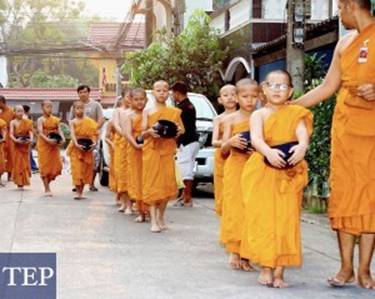 Description: Novice monks are taken out for morning alms collecting rounds as part of their training