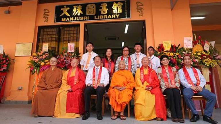Deputy Prime Minister Teo Chee Hean (seated, third from left), advisor to the Manjusri Library, is the guest-of-honour at its re-opening following a year-long $1 million refurbishment.&nbsp;-- ST PHOTO:&nbsp;ONG WEE JIN
