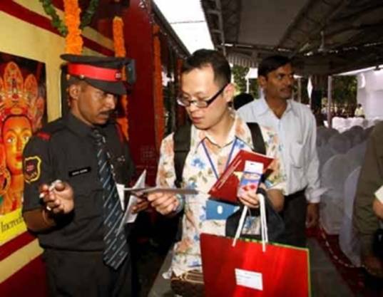 A passenger prepares to board the Buddhist Circuit Tourist Train. From irctctourism.com