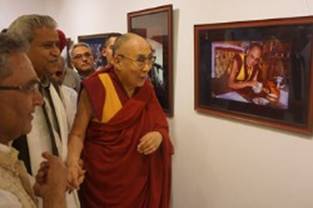 His Holiness has a light moment looking at one of his photos captured by Vijay