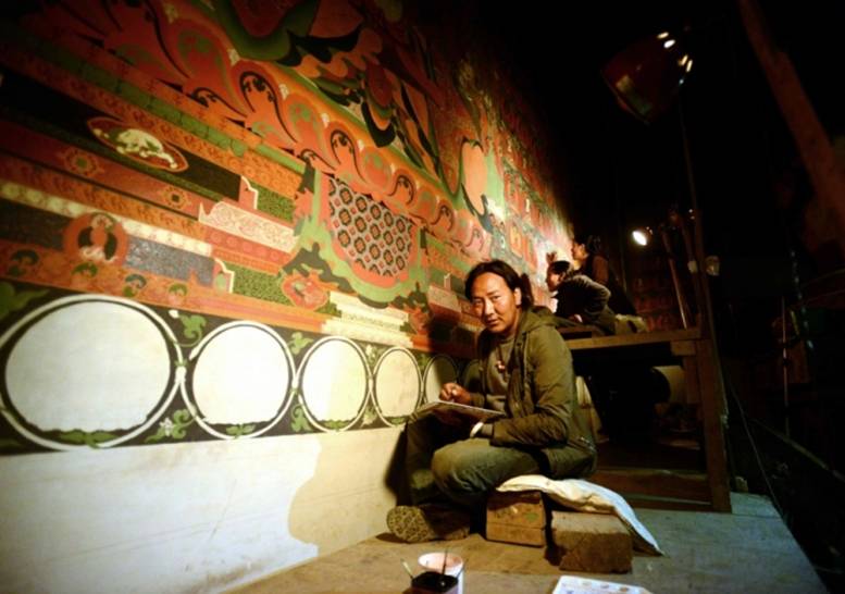Nepalese artist Tsewang Jigme restores a mural in the 15th-century Buddhist monastery Jampa Lhakhang in Upper Mustang. From gulfnews.com