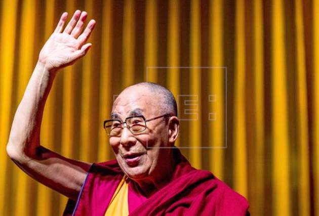 The Dalai Lama waves during the "Individual Commitment and Collective Responsibility" conference on Sept. 11 in Brussels. EPA/STEPHANIE LECOCQ