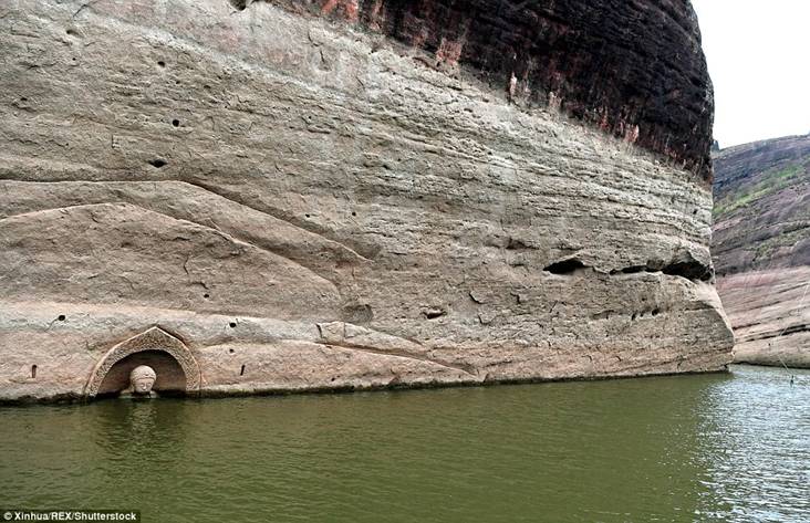 Forgotten by time: A long-lost Buddha appeared from under a lake in south-east China after the water level lowered 