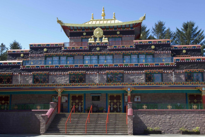 The Samyeling Tibetan temple, Europes first and biggest Buddhist monastery, in Eskdalemuir, and inset, Akong Tulku Rinpoche the subject of the film who was murdered in China four years ago. Picture: AFP/Getty Images)
