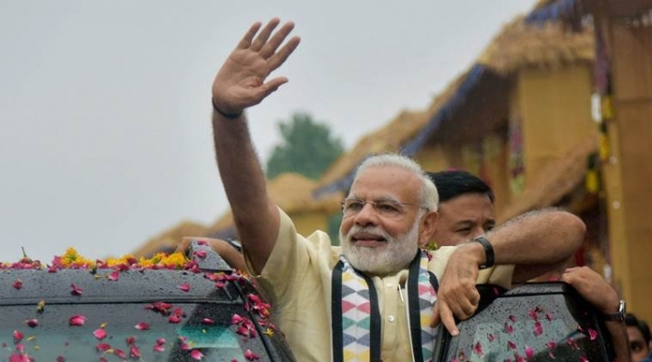 Indian prime minister Narendra Modi waves to supporters in the western state of Gujarat. From indianexpress.com