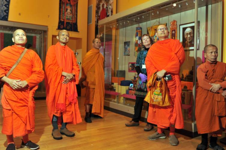 8 December 2017 .......       Thia Buddhist Monks from Wat Buddharam Temple on Cliff Road Headingley visit the new display on Buddhism opening at Leeds City Museums. Picture Tony Johnson