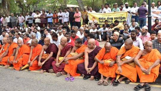 The National Bhikku Front said it organised the silent demonstration in Colombo to protest the communal violence. From aljazeera.com