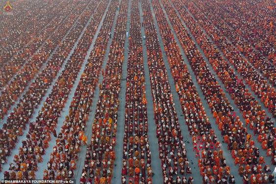 Description: Monks lining up during the alms-giving ceremony to 30,000 monks organised by the regional government of Mandalay affiliated with Dhammakaya Foundation at Chanmyathazi Airport in Mandalay today