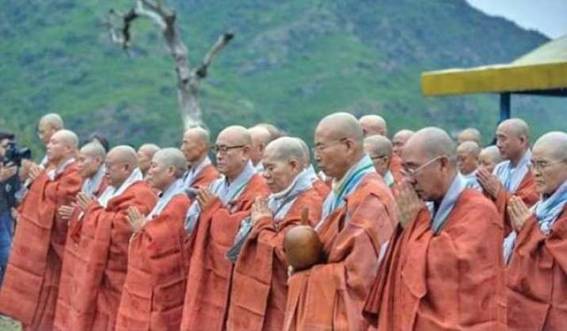 Description: Korean Buddhist monks perform a ritual at a historical site in Haripur. From tribune.com.pk