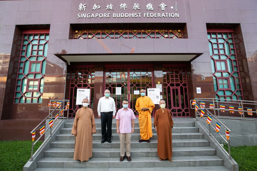 Minister for Culture, Community and Youth Edwin Tong (centre) visiting the Singapore Buddhist Federation on Sunday.