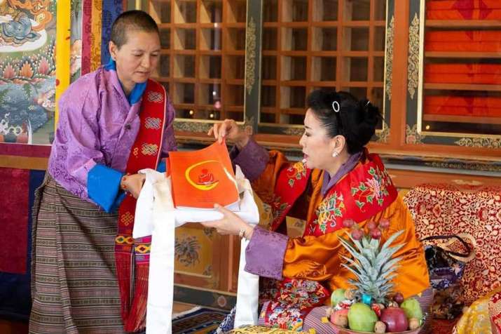 Dr. Zangmo presents the new training framework, <i>Nuns Empowerment Through Capacity and Skills Development</i>, to Her Majesty the Queen Mother Ashi Tshering Yangdoen Wangchuck. Image courtesy of the BNF