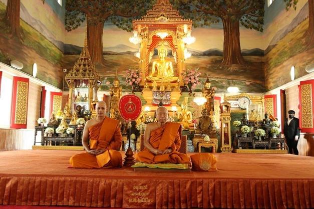 Gagan Malik sits beside the abbot of Wat That Thong in the main hall of the temple in Bangkok's Watthana district after he was ordained as a monk. Photo by worldofbuddhist.com